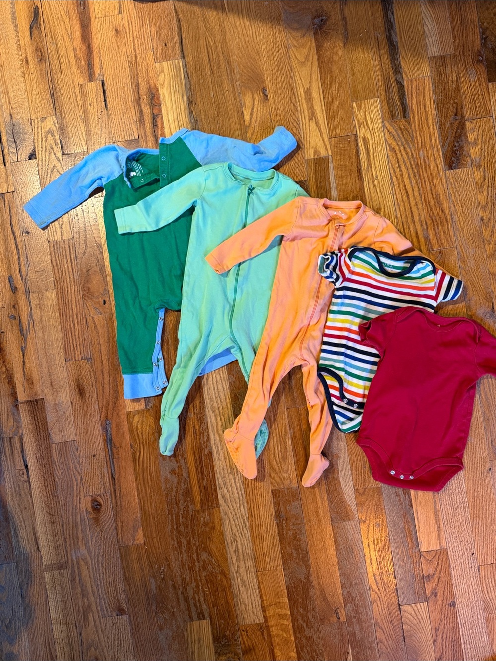 Primary 9-12m bundle: One-Piece Footed zips, snap pjs, and short sleeve onsies